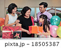 Grandma wearing a party hat at her birthday party 18505387