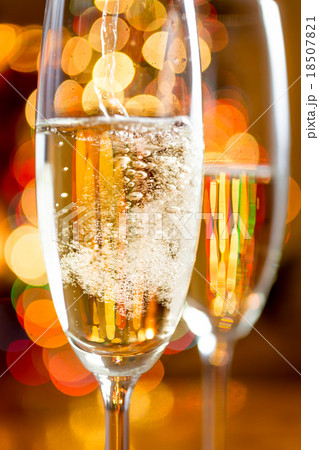bubbles of Champagne against sparkling lights 18507821