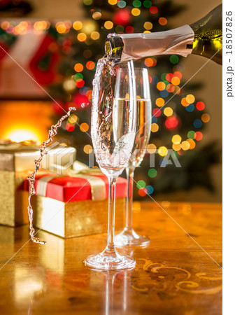 two champagne glasses on Christmas dining table 18507826