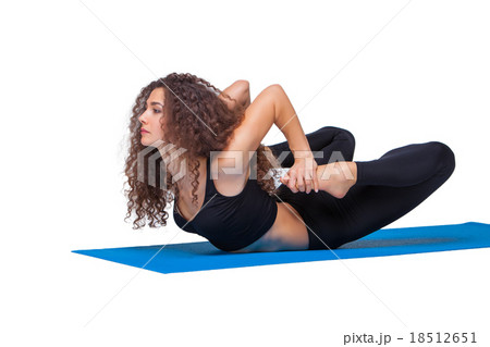 Studio shot of a young fit woman doing yoga 18512651