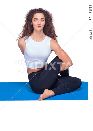 Studio shot of a young fit woman doing yoga 18512653