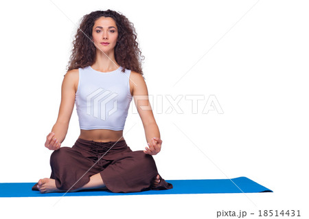 Studio shot of a young fit woman doing yoga 18514431