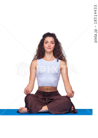 Studio shot of a young fit woman doing yoga Studio shot of a young fit woman doing yoga 18514433