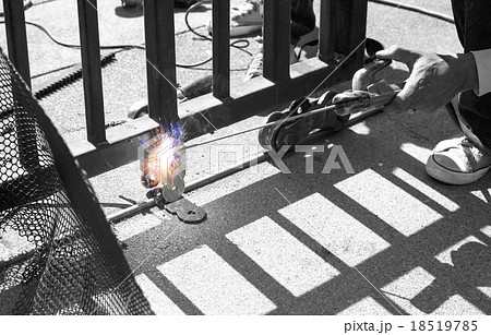 Welder making a fence roller 18519785