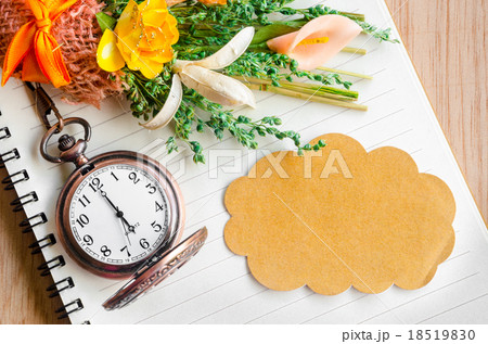 Blank brown tag and pocket watch. 18519830