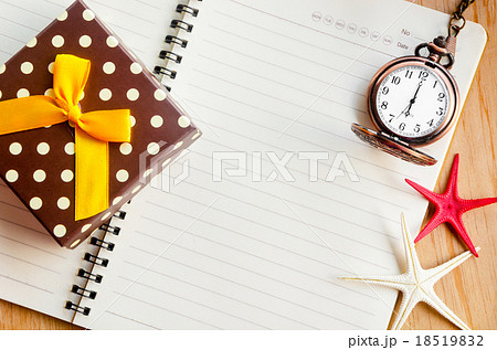 Open diary and pocket watch with gift box. 18519832