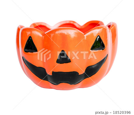 A ceramic cup with pumpkin halloween face shape. 18520396