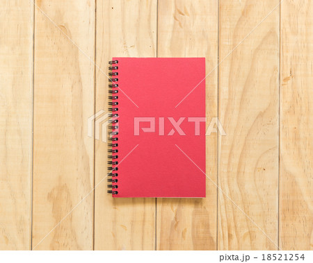 Top view of red book on wooden table 18521254