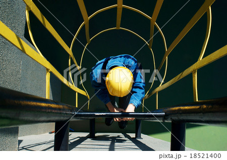 worker climbing in safety stair worker climbing in safety stair 18521400
