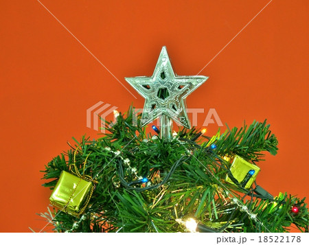 Silver star decorated on the top of Christmas tree 18522178