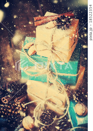 Stack of Holiday Boxes with Cord, Nuts. Drawn Snow Stack of Holiday Boxes with Cord, Nuts. Drawn Snow 18522354