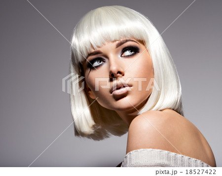 Beautiful girl with short hair. Hairstyle. Makeup 18527422