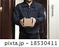 Postman delivers a small package 18530411