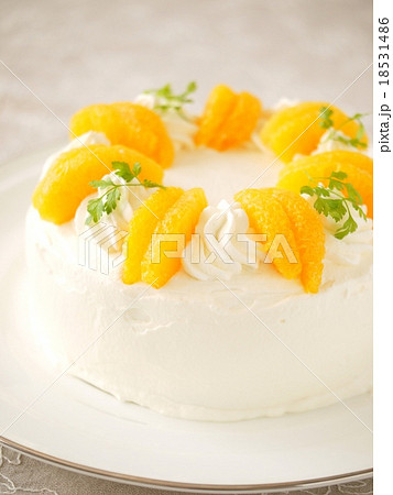 オレンジのスポンジケーキの写真素材