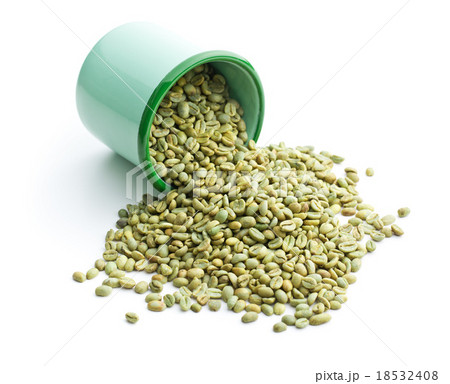 unroasted coffee beans in green mug 18532408