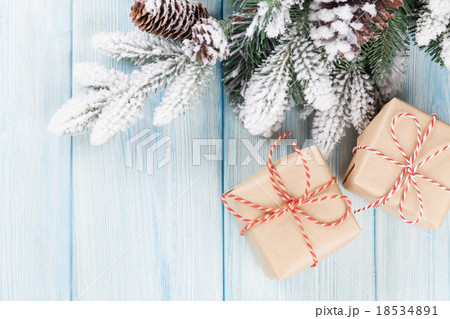 Christmas gift boxes and tree branch Christmas gift boxes and tree branch 18534891
