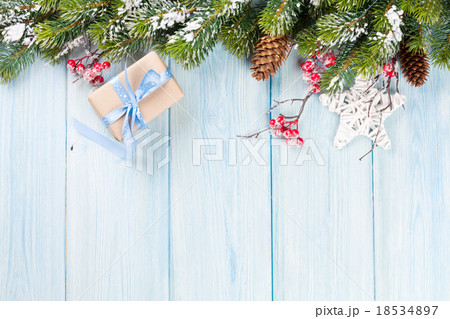 Christmas background with fir tree and gift Christmas background with fir tree and gift 18534897