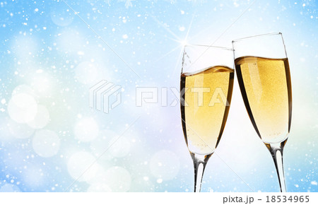 Two champagne glasses over christmas background 18534965