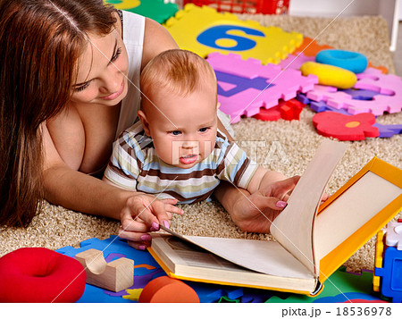Kid baby boy with mother plying puzzle toy on 18536978