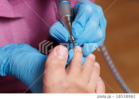 Pedicure Spa salon. Shaping nails and cuticles. Pedicure Spa salon. Shaping nails and cuticles. 18538962