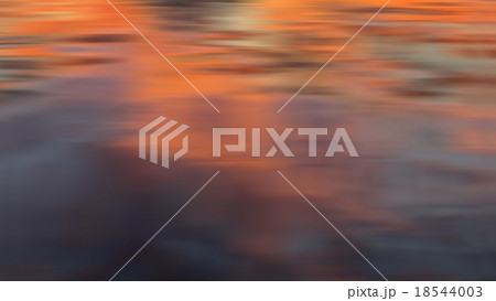 dramatic blurred sunset reflection background 18544003