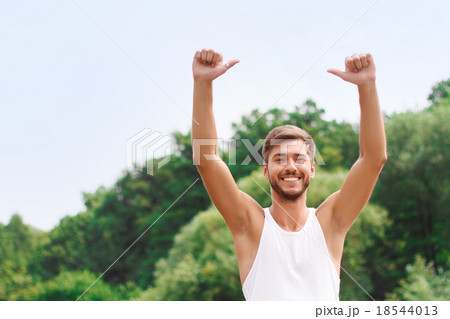 Active guy expressing positivity  18544013