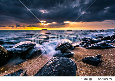 Rock and seascape at sunset time. 18548979
