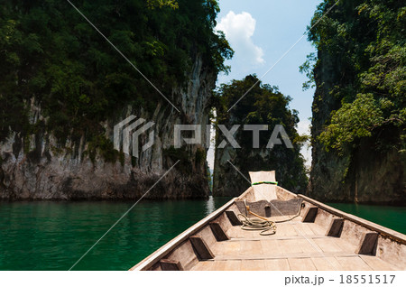 Longtail boat stopped at granite rock, Cheow Lan Longtail boat stopped at granite rock, Cheow Lan 18551517