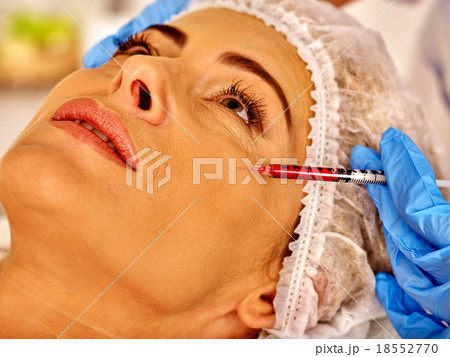 Woman middle-aged in spa salon with beautician Woman middle-aged in spa salon with beautician 18552770