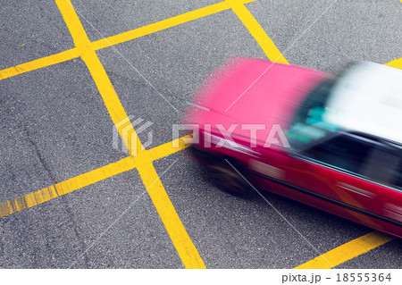 Motion blurred Taxi in Hong Kong 18555364