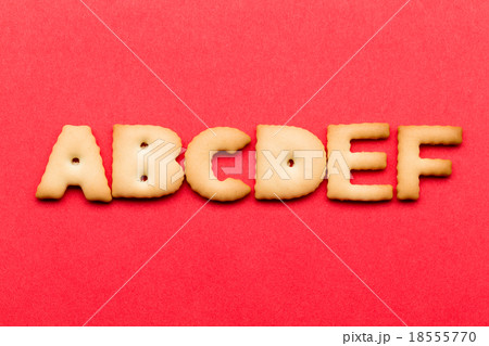 ABCDE biscuit over the red background 18555770