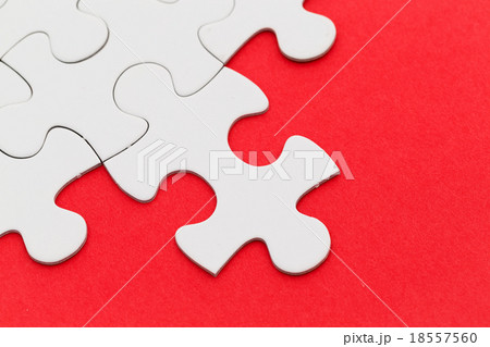 Jigsaw puzzle with missing red background Jigsaw puzzle with missing red background 18557560