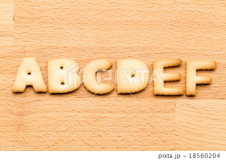 Letter ABCDEF cookie over the wooden background 18560204