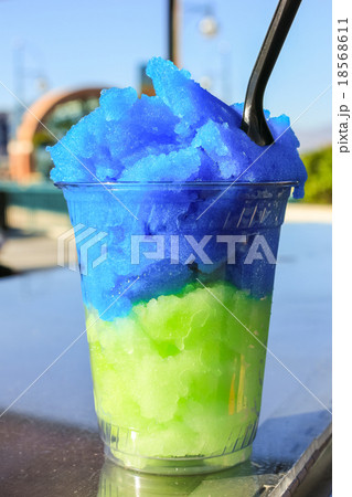 Snow cone in plastic cup. 18568611
