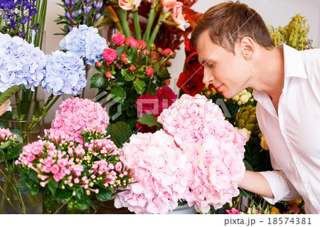 Nice man smelling the flowers 18574381