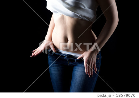 Undressing young woman, no face 18579070