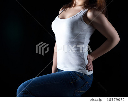 Young woman in white vest, no face Young woman in white vest, no face 18579072