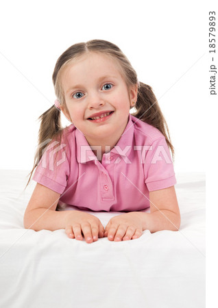 portrait girl in pink dress in bed 18579893
