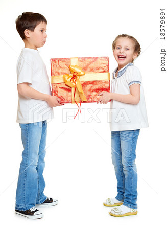 boy and girl with red gift box and golden bow  18579894