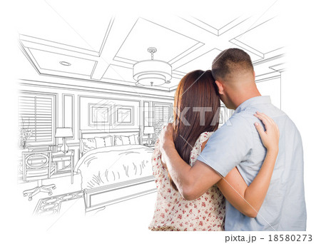 Couple Looking Over Custom Bedroom Design Drawing 18580273