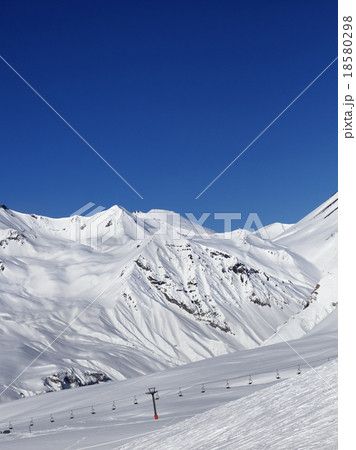 Ski slope and ropeway at nice sun day 18580298