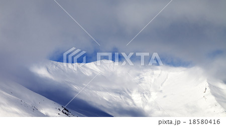 Panoramic view on off-piste slope in mist 18580416