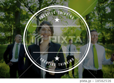 Business People Holding Green Balloon In Forest Business People Holding Green Balloon In Forest 18582516