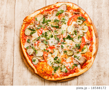 pizza on the wood background pizza on the wood background 18588172