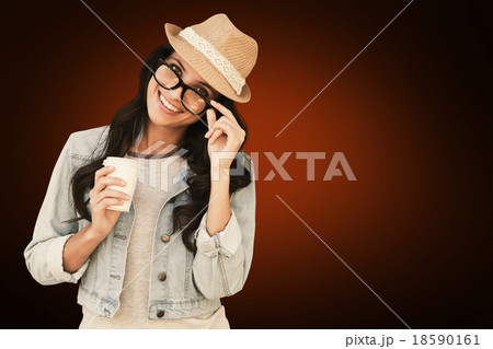 Composite image of brunette with disposable cup 18590161