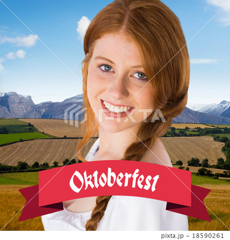 Composite image of oktoberfest girl smiling at camera 18590261