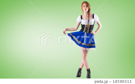 Composite image of oktoberfest girl spreading her skirt Composite image of oktoberfest girl spreading her skirt 18590313