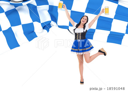 Composite image of pretty oktoberfest girl holding beer tankards Composite image of pretty oktoberfest girl holding beer tankards 18591048