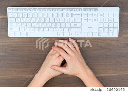 Humans hands with keyboard on table Humans hands with keyboard on table 18600166