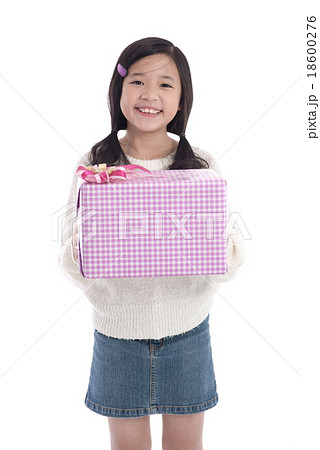 Cute asian girl giving a present 18600276